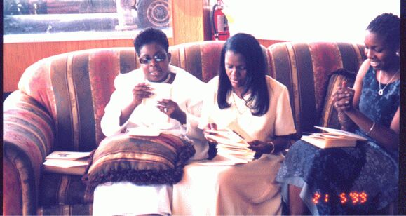 Nanda, Debra and Sharon, folding the funeral programmes